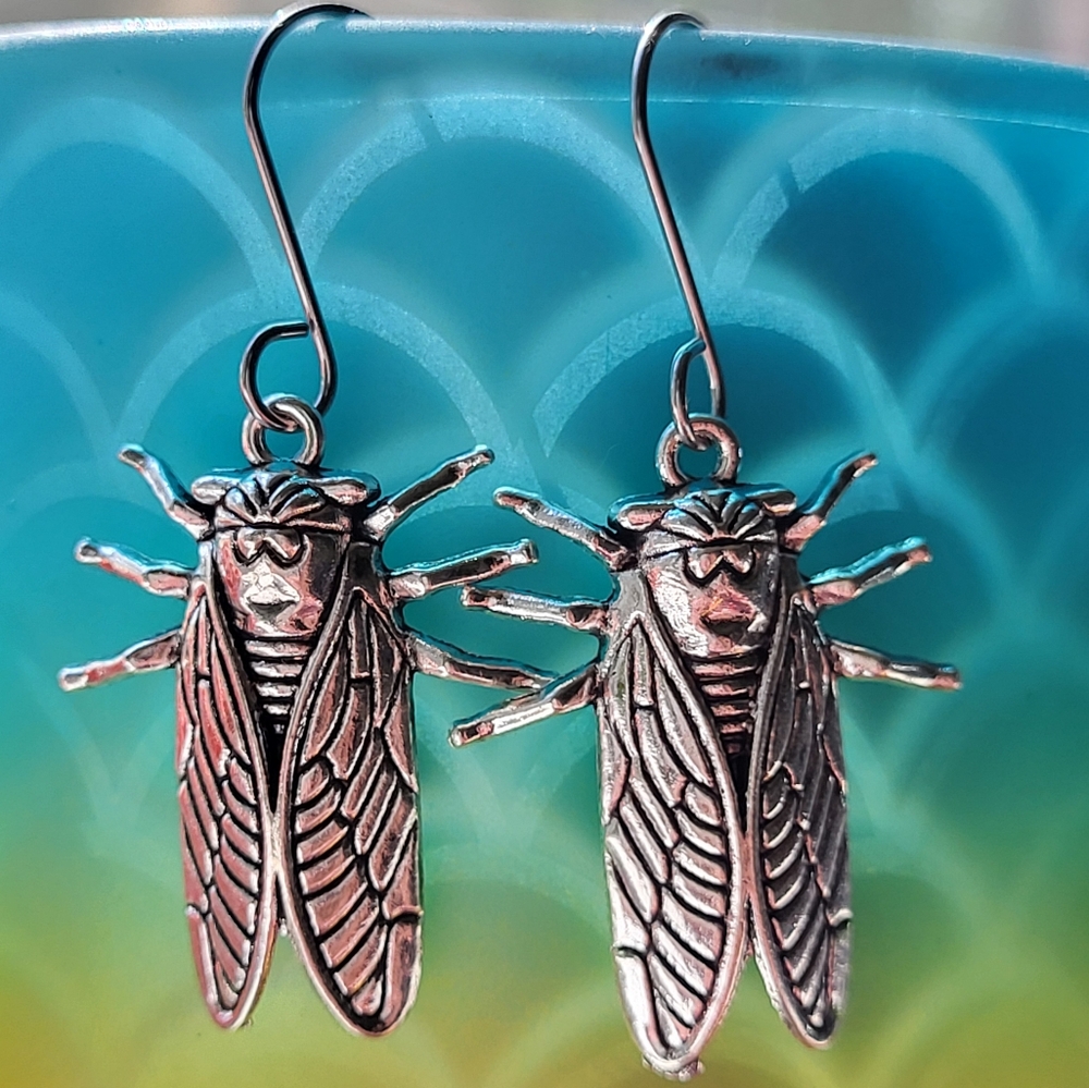 Silvertone cicada dangle earrings